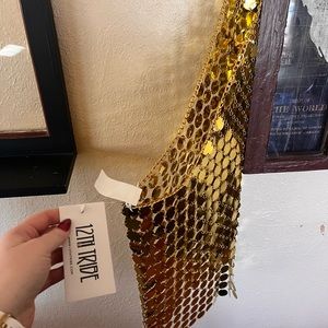 Gold-sequined dress. Open back. Never worn-tag still on. Great quality.